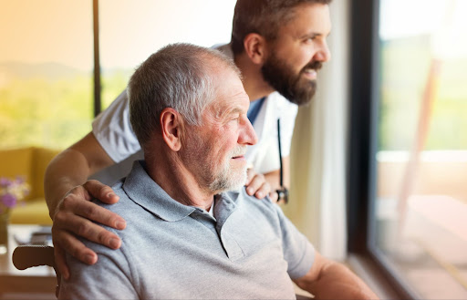 two men staring out window