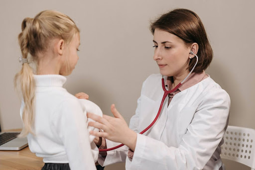 Doctor checking child