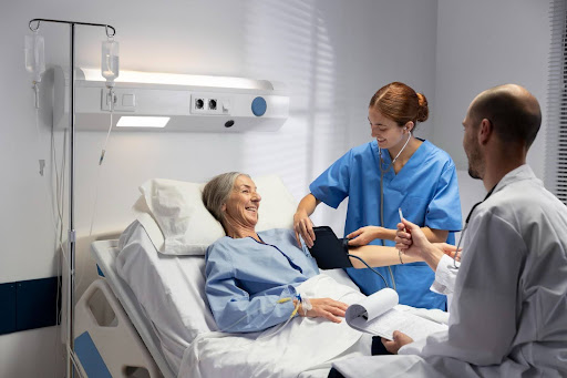 Doctors checking on elderly patient