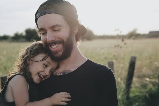 Man carrying his daughter