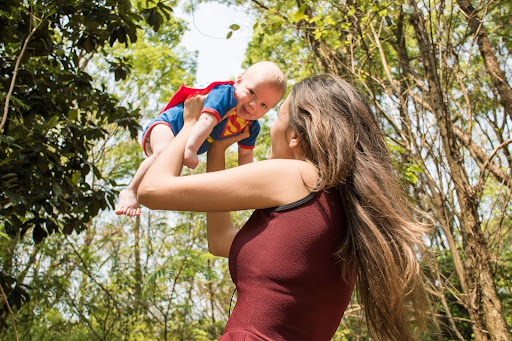 Woman carrying a child